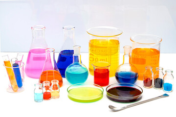 Laboratory glassware with various colored liquids in chemistry laboratory. Volumetric laboratory...