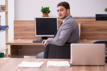 Young businessman employee working in the office