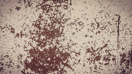 An old destroyed wall with cracks and scratches. Abstract grunge background texture for design posters, advertising and more.