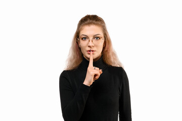 Serious young woman shushing, show taboo hush gesture and frowning, be quiet, standing angry...