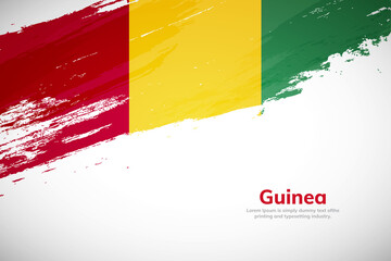 Brush painted grunge flag of Guinea country. Hand drawn flag style of Guinea. Creative brush stroke concept background