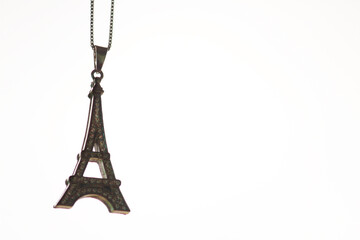 Eiffel Tower necklace momento against white background