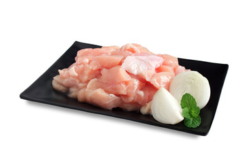 Fresh chicken breast sliced marinated with sesame oil in black plate isolated on white background, Decorated with onion and mint leaf, Hygienic food preparation for healthy and health care concept.