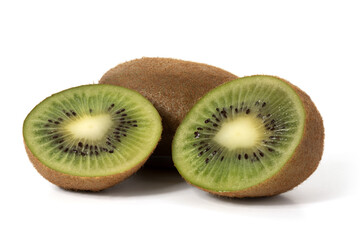 Two halves and a whole kiwi on a white background. Foreground. Full depth of field