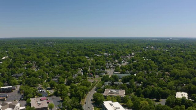 Aerial View of Suburban Homes in Charlotte, North Carolina, Hidden by Thic Green Trees