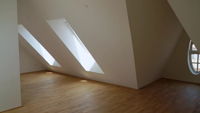 Big attic apartment in the city centre. Panning a big room for real estate video.