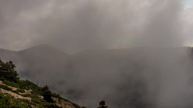 Dramatic clouds moving through sky in Parnitha national park, Greece