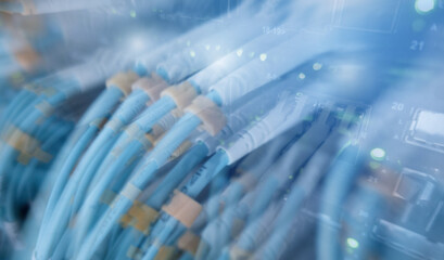 Close up fiber optic and hub telecommunication in server room.	
