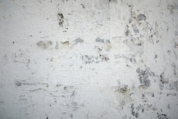 white concrete surface and white paint peeling from the wall, for use as a background.