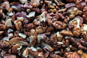 Background of peeled walnuts. Many peeled walnuts. Raw nuts.