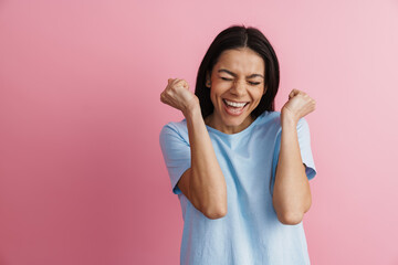 Excited hispanic woman gesturing and laughing at camera