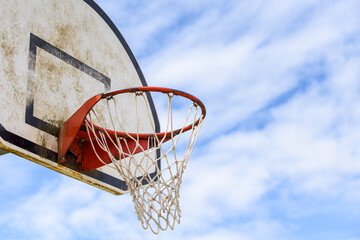 Basketball hoop with net on an outdoor basketball court