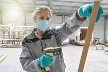 Stock manager reading  informations with a wireless barcode scanner