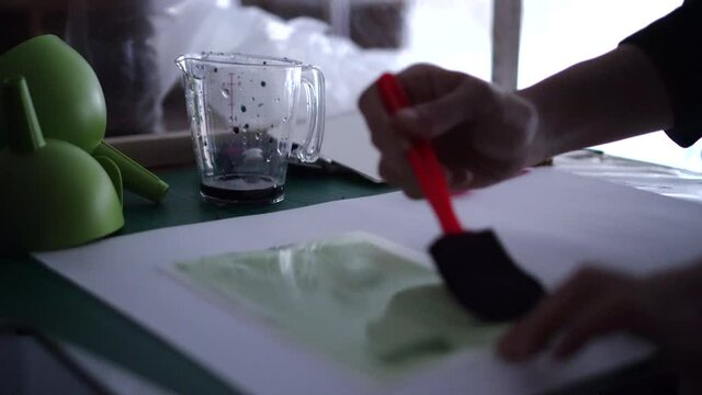Printmaking cyanotype prepare process coating green substance before putting them in sun light