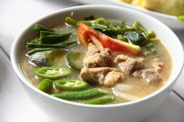 Filipino food called Pork Sinigang or pork and vegetables in tamarind broth