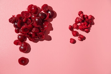 peeled ripe pitted cherries. pink background