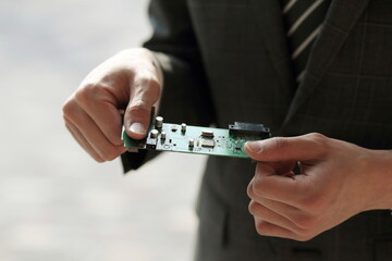 Close up of businessman holding main board