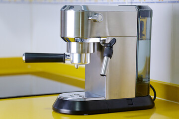 Coffee machine to make an espresso in a kitchen. Breakfast and home equipment concept.