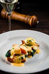 Sandwich with poached egg, parma ham egg and ham on toast