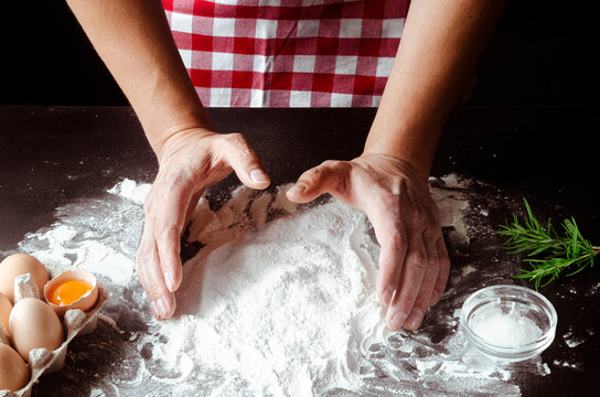 Chef's hands prepare dough for pizza. Fresh natural healthy food