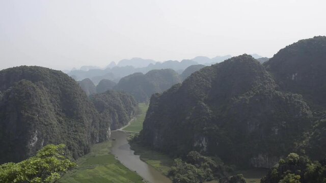 Top view of Hang Mua (Mua Cave) in NinhBinh with spectacular panoramic view of rice fields, limestone mountains. Tamcoc view from Mua cave. Ngo Dong river in Tam Coc, Vietnam.