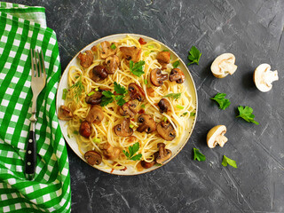 pasta with mushrooms on a concrete background