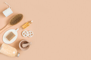 Body treatment and spa composition. Flat lay with natural beauty products. Eco cream, serum, skin care blank bottle. Brush for dry anti-cellulite massage. Dropper glass Oily cosmetic pipette