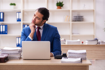 Fototapeta premium Young male employee feeling bad in the office
