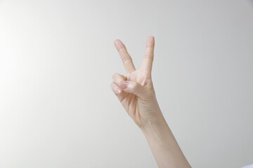 Woman showing two fingers gesture 