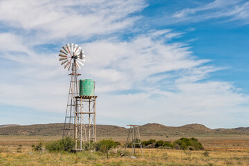 Water-pumping windmill and water tank on farm near Hanover