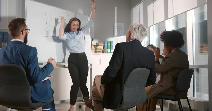 Business people making team training exercise during team building seminar