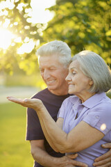 Fototapeta premium senior couple in the park showing something