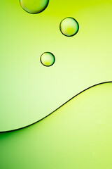Abstract colourful background with lines and circles, vibrant colours of macro oil and water drops. Close up of oil drops on bright background. copy space for text