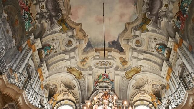 Turin, Piedmont, Italy. May 2021. Footage with tilt of the enchanting ceilings of the queen's villa: the frescoes have bright and vivid colors.