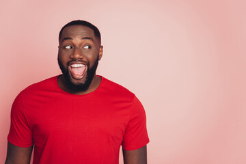 Photo of dark skin guy unexpected good news isolated over pink background
