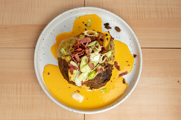 Potato stuffed from above on wooden background