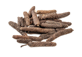 pile of java long pepper catkins closeup on white