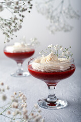 Raspberry-strawberry dessert with cheese cream in verrin