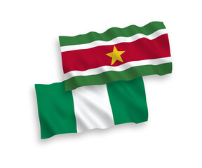 Flags of Republic of Suriname and Nigeria on a white background