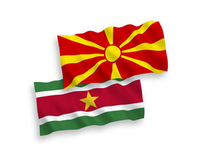 Flags of Republic of Suriname and North Macedonia on a white background