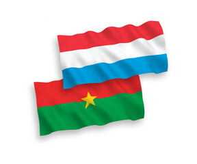 Flags of Burkina Faso and Luxembourg on a white background