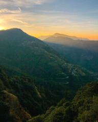 Obraz premium Beautiful sunrise behind the hills