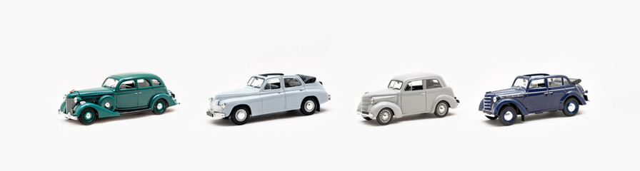 Fototapeta na wymiar Collection of toy vintage cars on a white background isolate