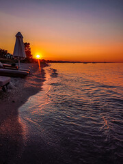 Sunset at Chalkidiki Greece, calm sea water  and sandy beach  