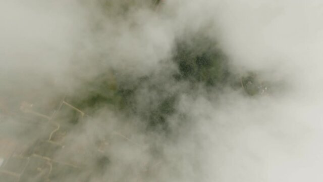 Stunning video of a fpv drone flying at high speed over the clouds. Surfing the clouds, Concept of sky diving, airplane crash.