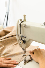 Sewing machine and fabric on a light background