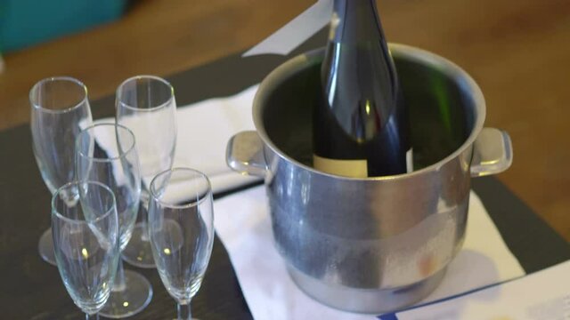 Champagne glasses and chilled champagne on the table in 4k slow motion 60fps

