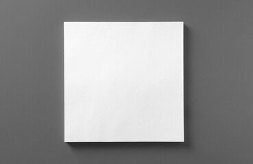 Stack of blank paper sheets for brochure on light grey background, top view