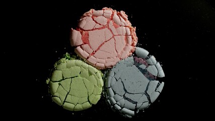 Crushed Colorful Macarons On A Black Background - 433443792
