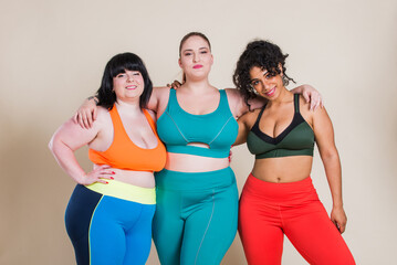 Plus size women making sport in the gym